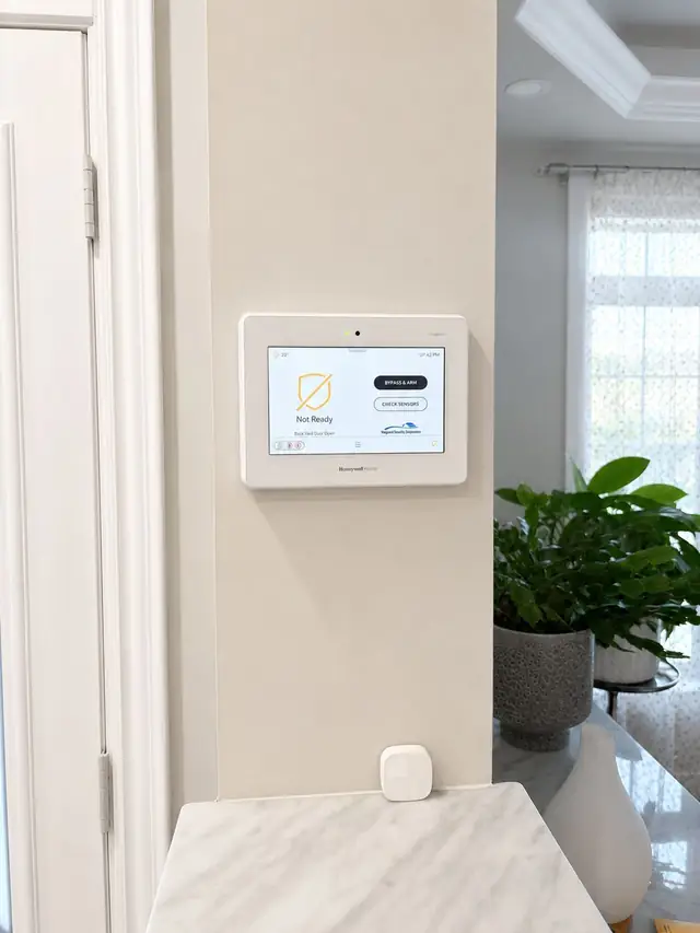 Alarm keypad on the wall by the front entry