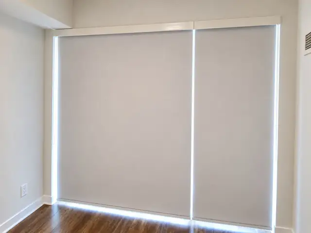 Light-filtering roller shades across living-room windows